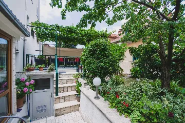 Split 3-Bedroom Apartment with Private Garden