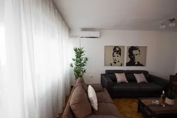 Split 3-Bedroom Apartment with City-View Balcony