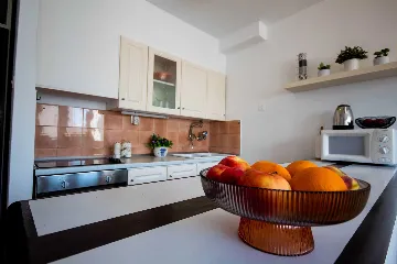 Split 3-Bedroom Apartment with City-View Balcony