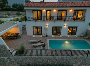 Villa for 7 Guests in Vrbnik with Pool and Sea View