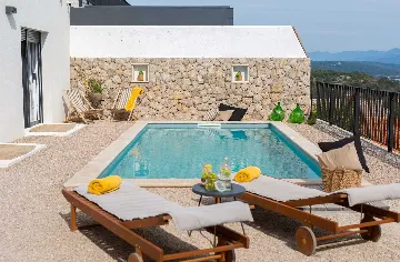 Villa for 7 Guests in Vrbnik with Pool and Sea View