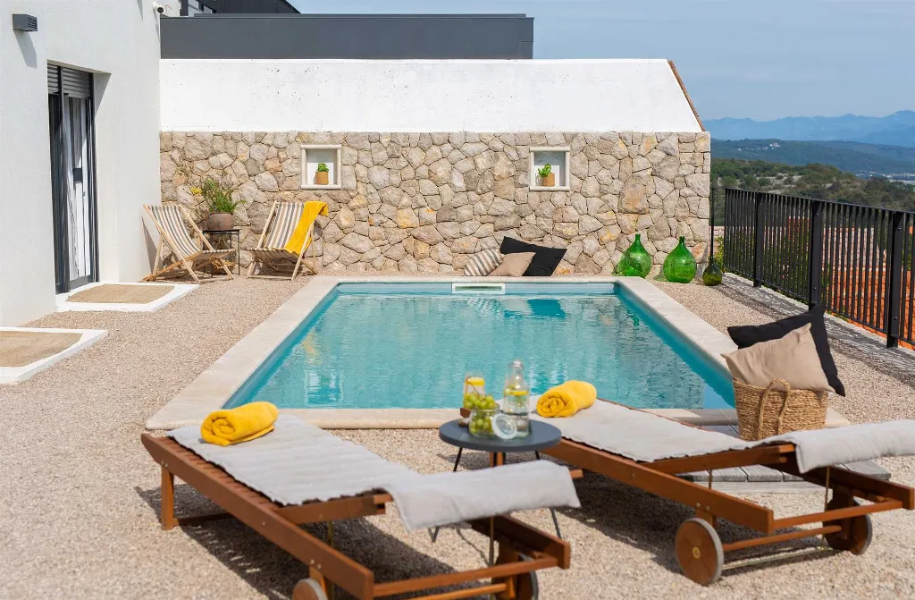 Villa for 7 Guests in Vrbnik with Pool and Sea View