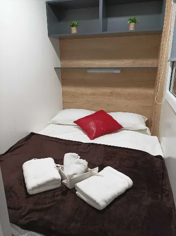 Mobile Home with Terrace and Shared Pool in Pirovac