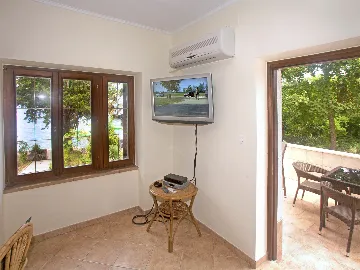 Seafront Apartment in Njivice for 4 Guests
