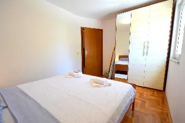 Two-Bedroom Apartment in Malinska for 4 Guests