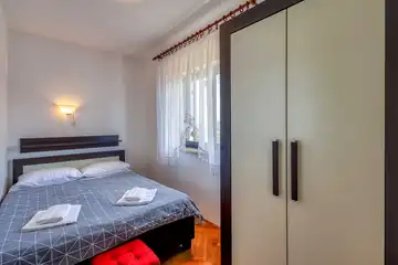 Two-Bedroom Apartment in Malinska for 4 Guests