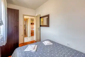 Two-Bedroom Apartment in Malinska for 4 Guests