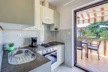 Two-Bedroom Apartment in Malinska for 4 Guests