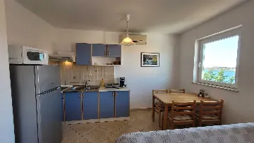 Two-Bedroom Apartment in Omisalj for 4 Guests
