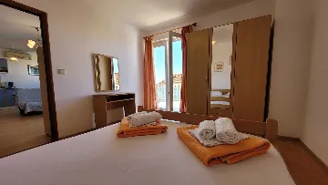 Two-Bedroom Apartment in Omisalj for 4 Guests