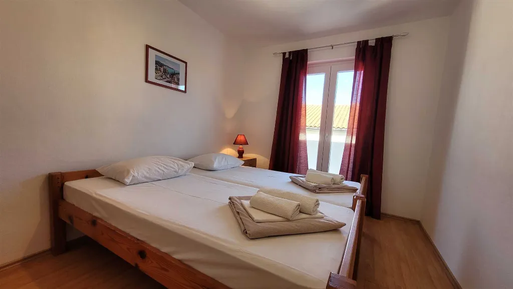 Two-Bedroom Apartment in Omisalj for 4 Guests