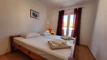 Two-Bedroom Apartment in Omisalj for 4 Guests