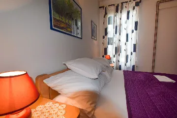 Two-Bedroom Apartment in Malinska for 4 Guests