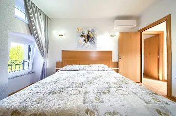 Two-Bedroom Apartment in Malinska for 5 Guests