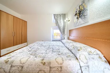 Two-Bedroom Apartment in Malinska for 5 Guests