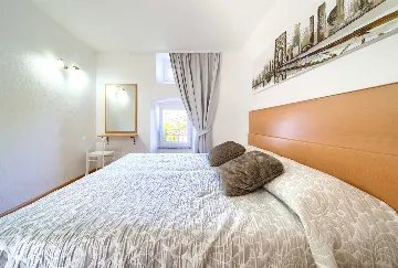 Two-Bedroom Apartment in Malinska for 5 Guests