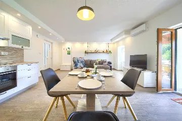 Two-Bedroom Apartment in Malinska for 5 Guests