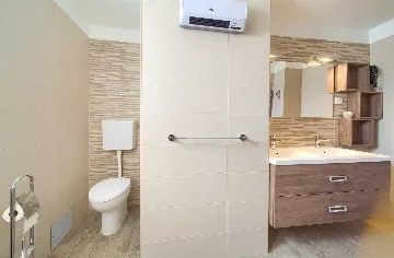 Two-Bedroom Apartment in Malinska for 5 Guests