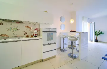 Two-Bedroom Apartment in Malinska for 4 Guests