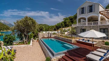 Modern 4-Bedroom Seaside Villa Žrnovo with Pool