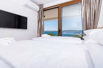 Contemporary Beachfront Villa with Sea Access in Okrug Donji