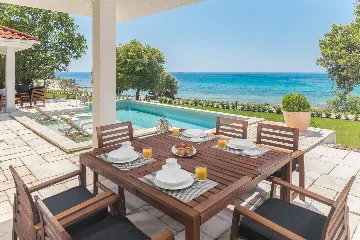 Contemporary Beachfront Villa with Pool in Bale