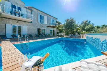 Beachfront Villa with Heated Pool in Mirca