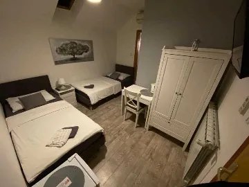 Room with Two Beds and Roof Window in Zagreb