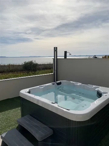 Beachfront 2-Bedroom Villa in Privlaka with Jacuzzi