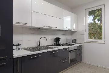 Podstrana Beachfront Apartment with Private Cove