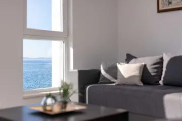 Podstrana Beachfront Apartment with Private Cove